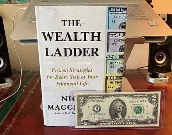 wealth ladder book + $2 note